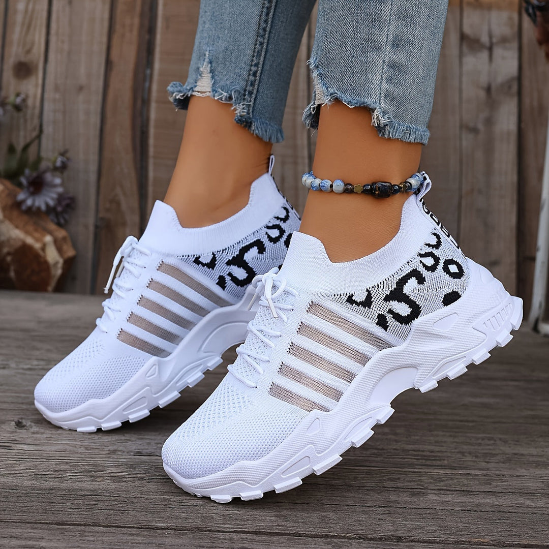 A woman walking in light, breathable comfort trainers on a warm day.