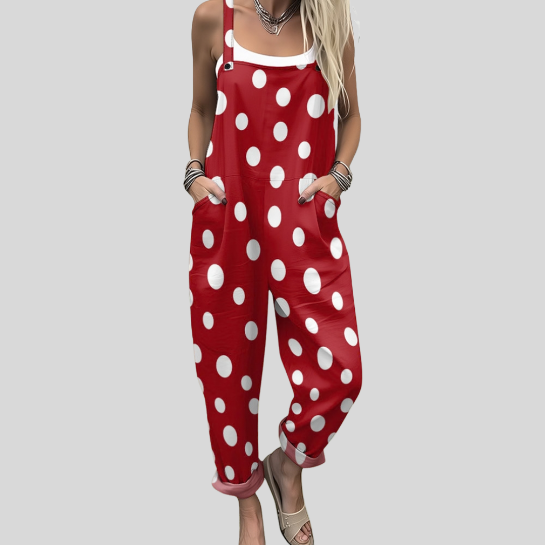 Red wide-leg dungarees with large white polka dot pattern and adjustable shoulder straps.