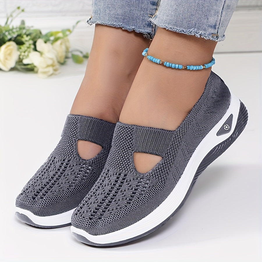 A woman stepping into easy slip-on comfort trainers with no laces.