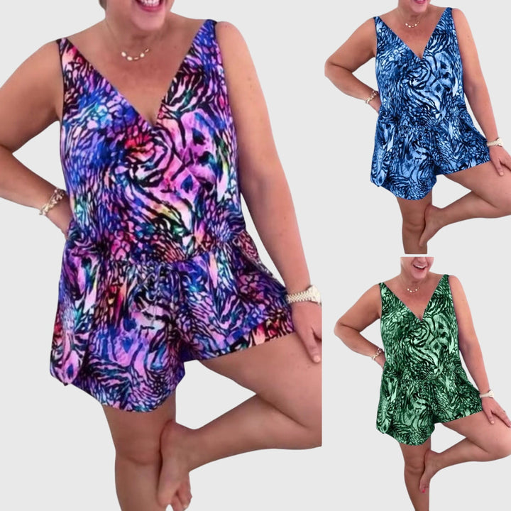 Women's swim dress in blue, purple and green with an elegant skirt silhouette