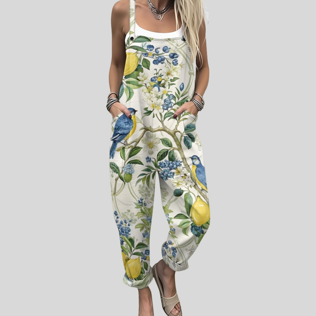 Cream wide-leg dungarees with a botanical print of lemons, blueberries, green branches and a small bird.