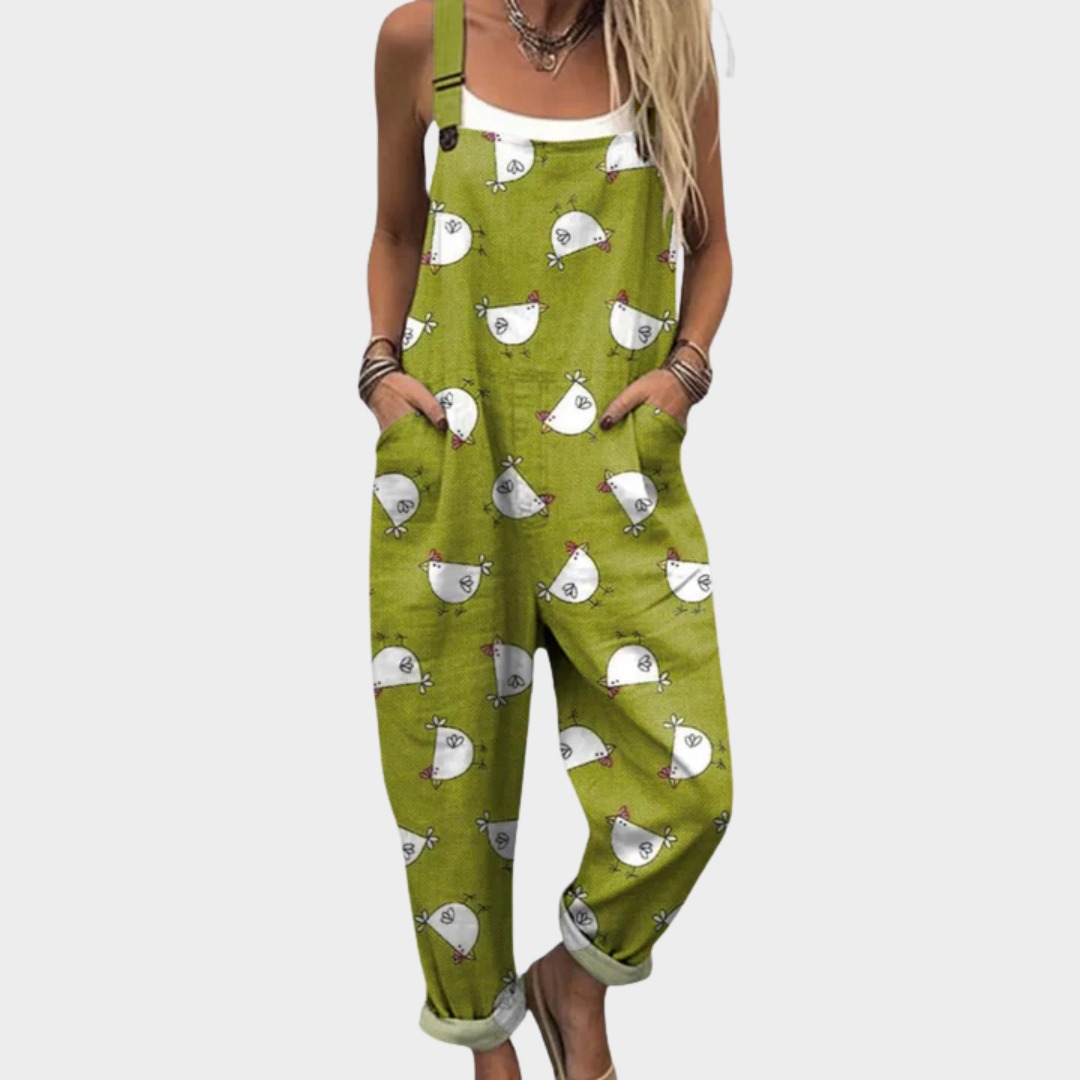 Woman wearing fresh green dungarees printed with little white hens