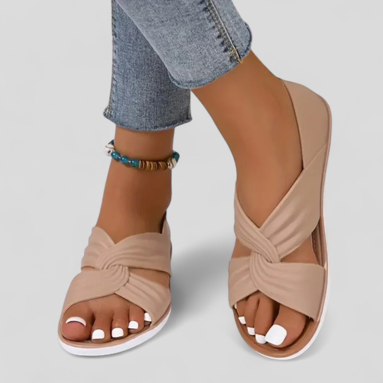 Flat cross-front sandals with a back strap in black, beige and red
