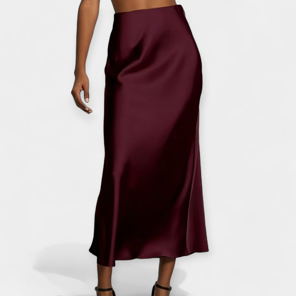 High-waist smooth midi skirt in black with a flowing wide-cut silhouette and lustrous finish
