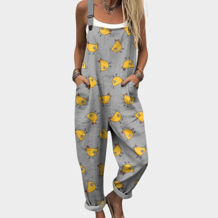 Woman wearing fresh green dungarees printed with little white hens