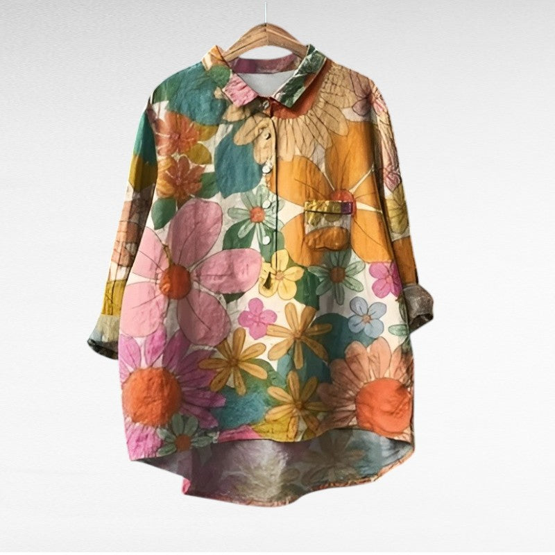 Woman wearing a printed summer blouse with a gentle, flattering drape.