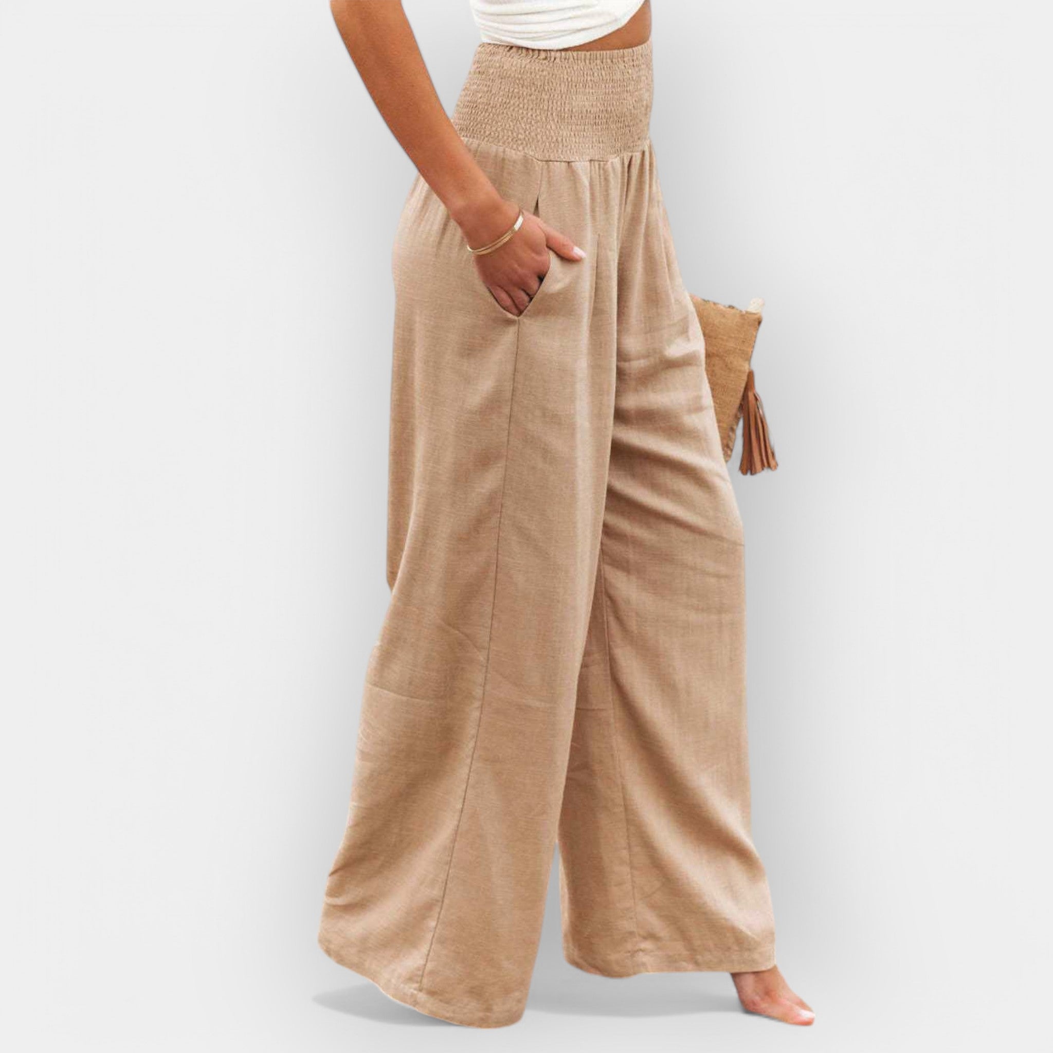 White wide-leg trousers with an elastic waist and a light, flowing silhouette