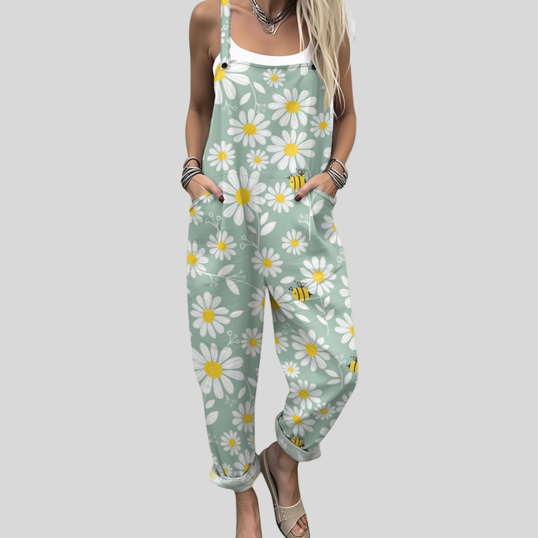 Sage green wide-leg dungarees with a meadow print of white daisies and cheerful bees.