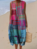 A sleeveless rhythmic patchwork stripe dress in vivid electric blue, pink, green and purple
