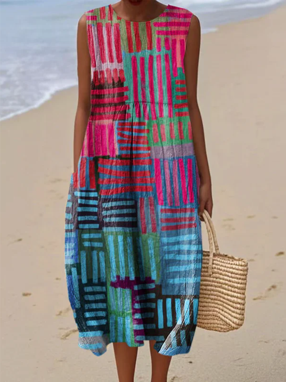 A sleeveless rhythmic patchwork stripe dress in vivid electric blue, pink, green and purple
