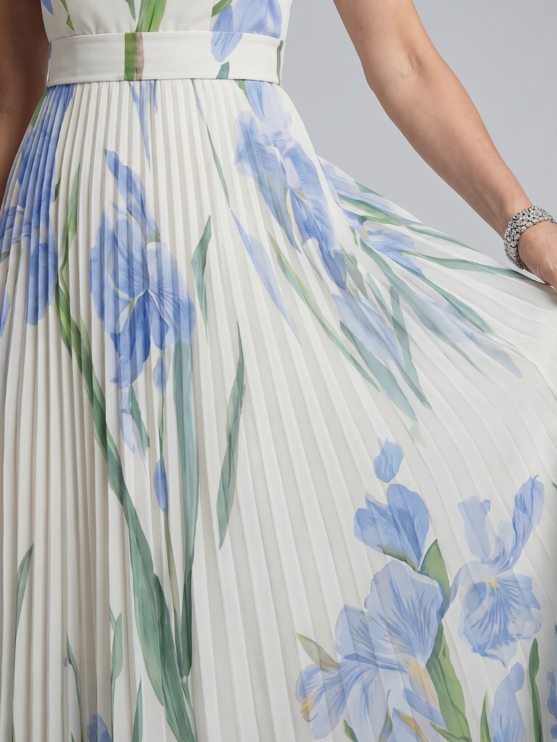 White floral midi dress with a square neckline and pleated flowing skirt