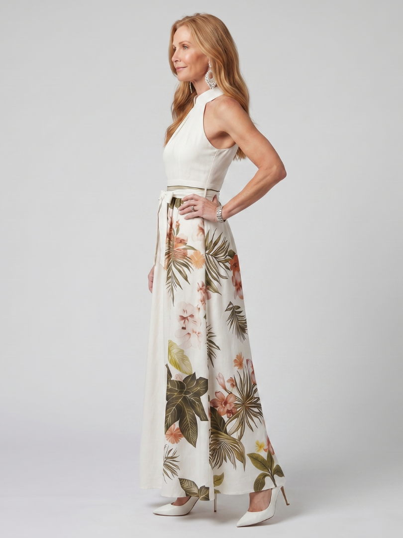 White botanical print halter maxi dress with a draped neckline and bow waist detail