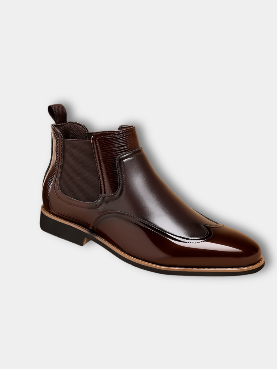 Men's brown classic Chelsea boots with elastic side panels and a smooth structured upper