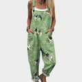 Green printed wide-leg dungarees with adjustable straps and a light, floaty silhouette