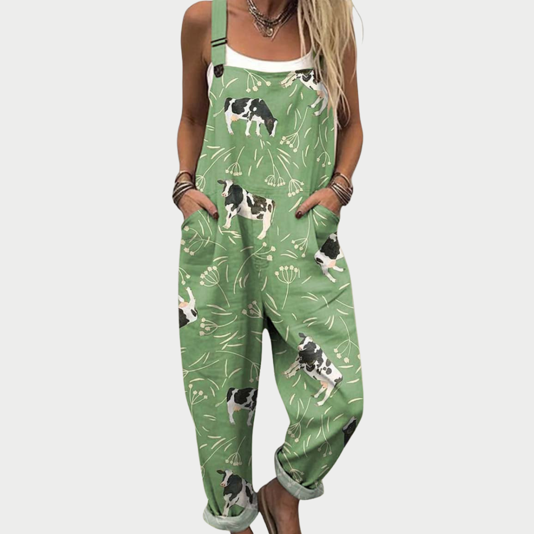 Green printed wide-leg dungarees with adjustable straps and a light, floaty silhouette