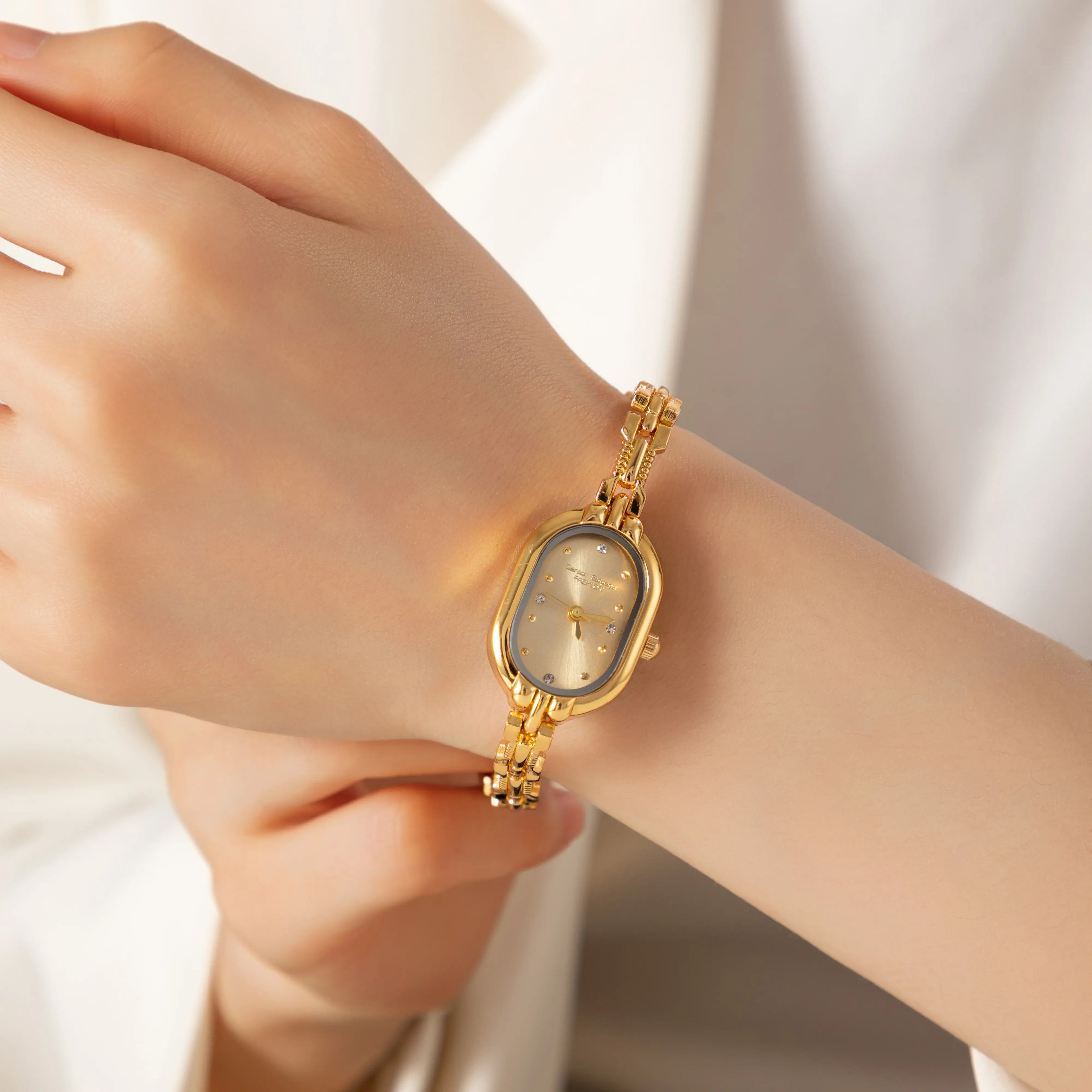 Women's slim minimalist watch with a clean dial and fine strap in a classic finish