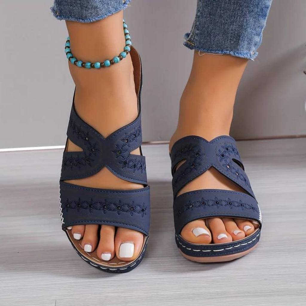 Women's crossover backless sandals with a cushioned footbed, shown in multiple summer colours