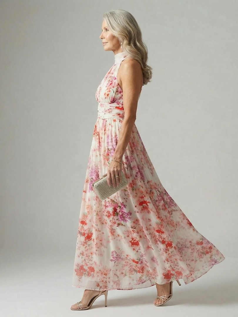 Floral halter neck maxi dress with a ruched neckline detail and a relaxed flowing skirt