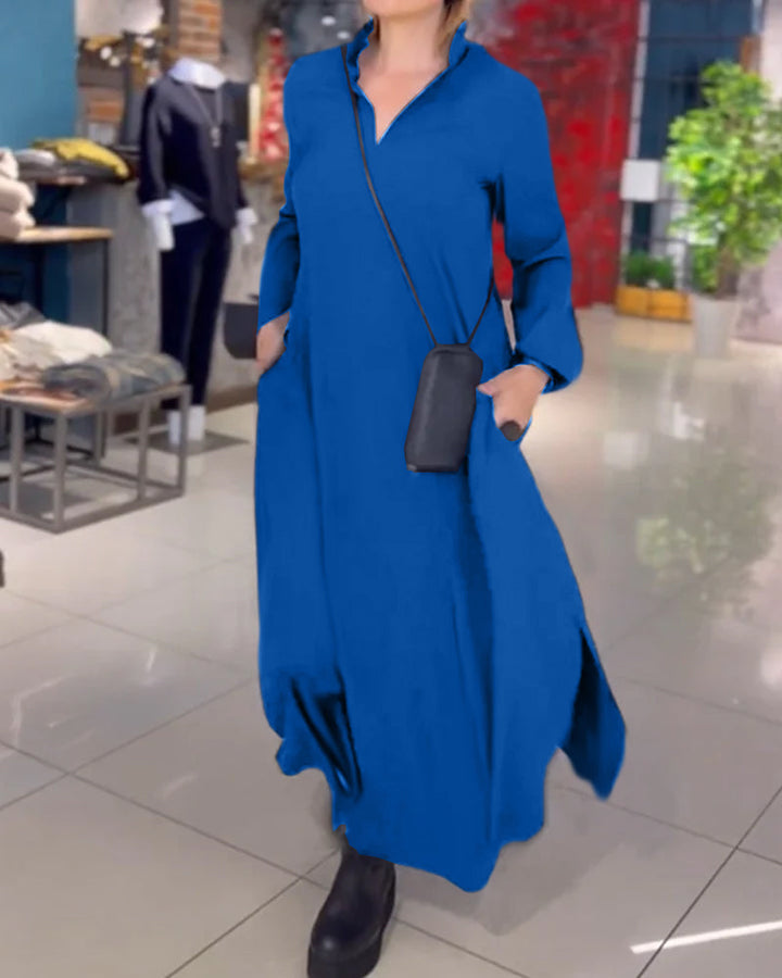 Woman wearing the Sarah relaxed maxi dress with revere collar, standing by a doorway.