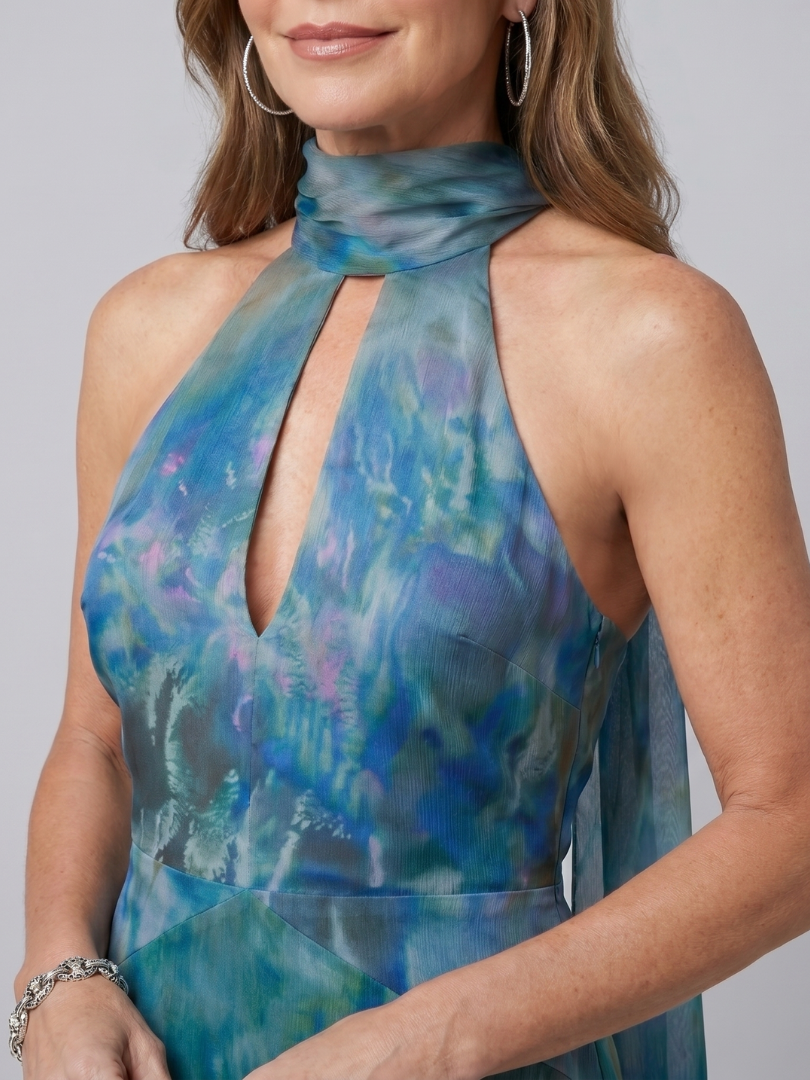 Blue halter neck maxi dress with a sheer floaty overlay and front slit