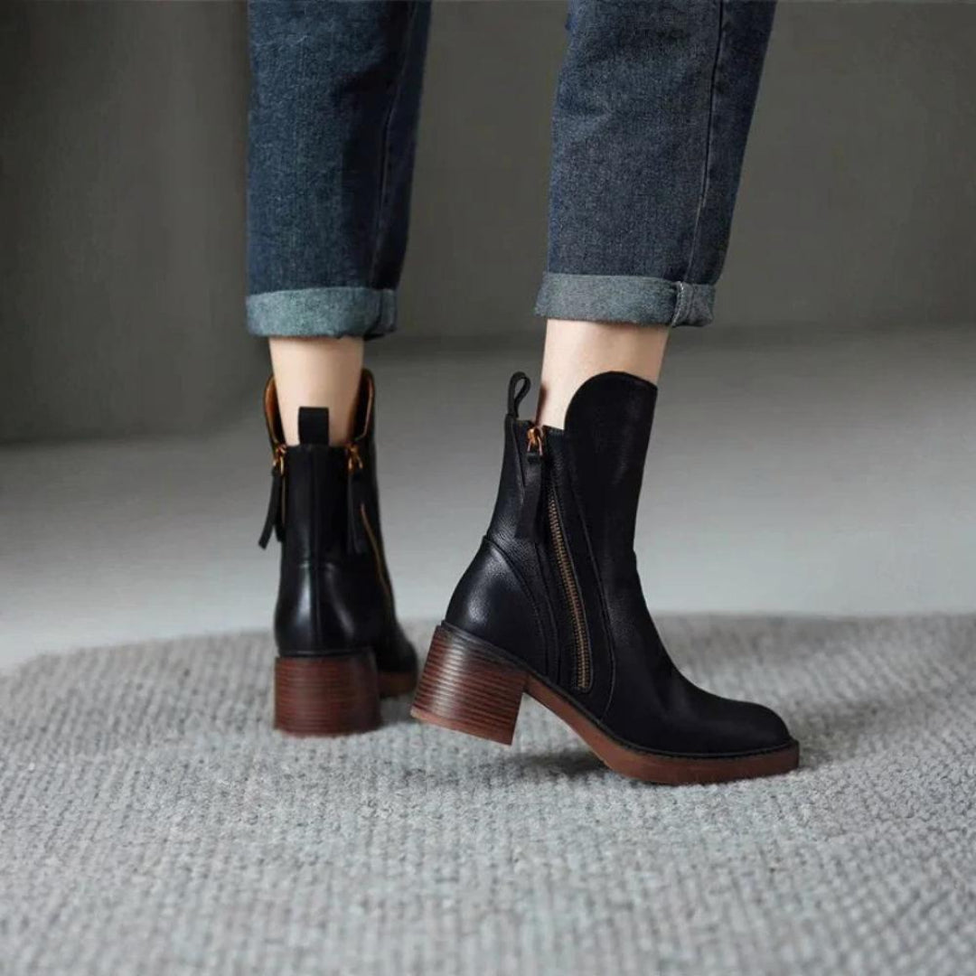 Classic black ankle boots with a stable heel and side zip fastening