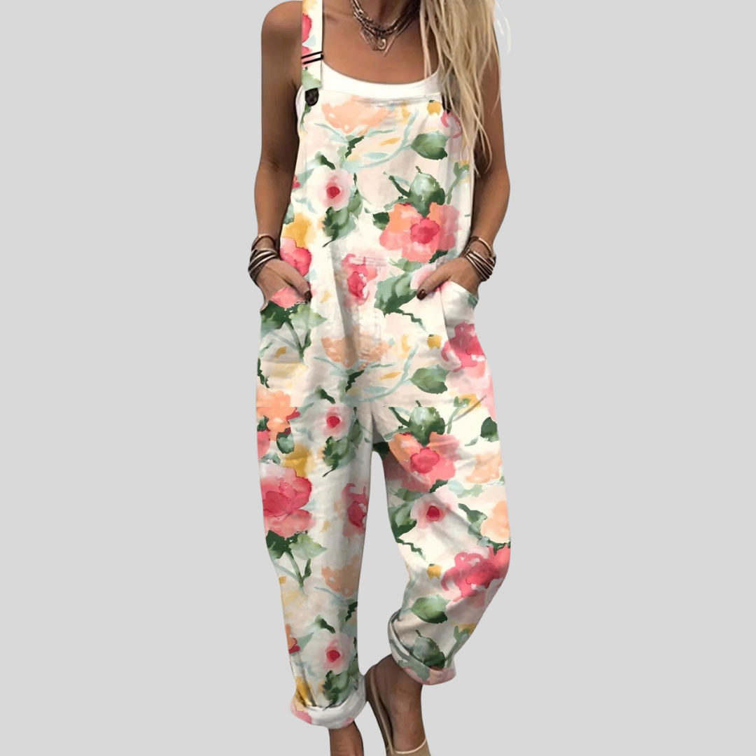 Cream wide-leg dungarees with a soft watercolour rose print in blush pink and peach tones.