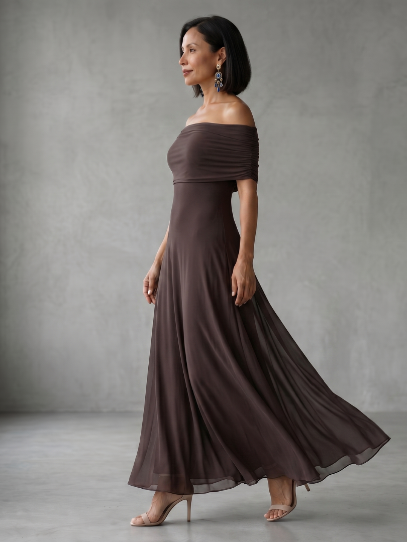 Brown midi dress with off-shoulder draped neckline and sheer outer layer over smooth lining