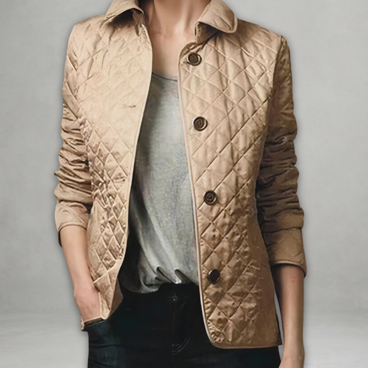 A woman wearing an autumn jacket over a top, layered for a crisp day in town.
