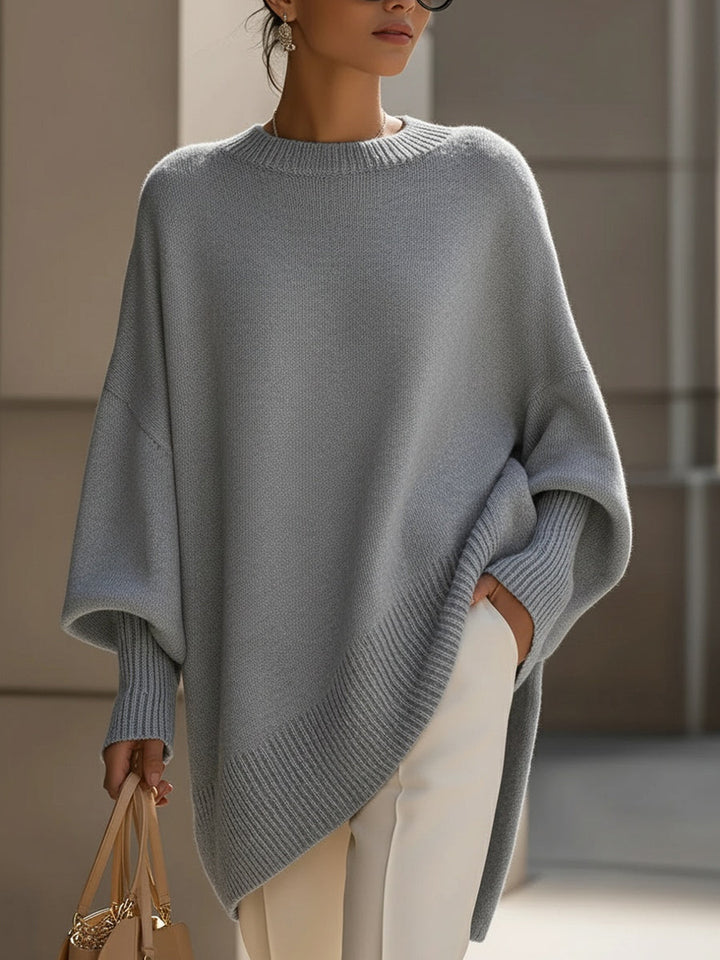 A woman wearing a soft crew neck jumper with jeans for a warm, easy everyday look.