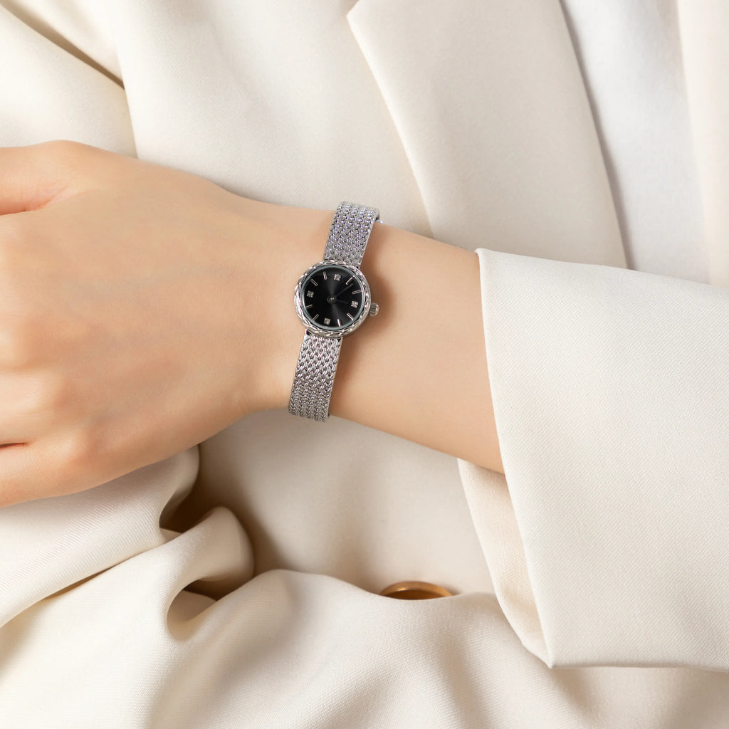Women's minimalist gold watch with a simple round face and clean gold-tone finish