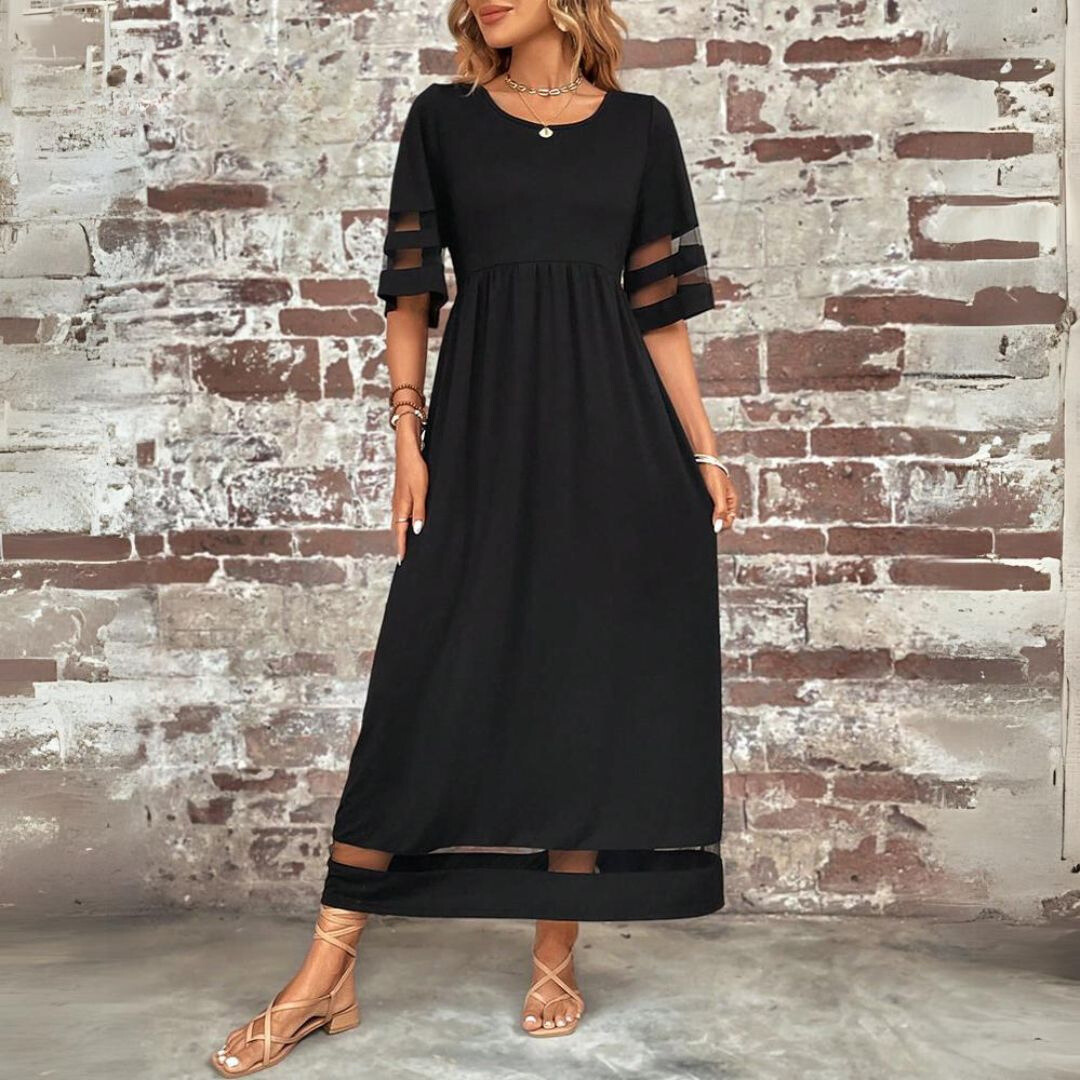 Woman wearing the Winifred™ empire waist midi dress with a flowing skirt and round neckline at a family gathering.
