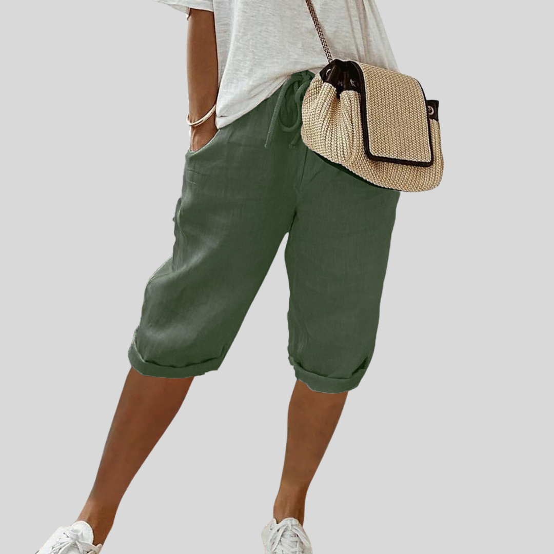 Wide-leg high-waist trousers in a neutral beige tone