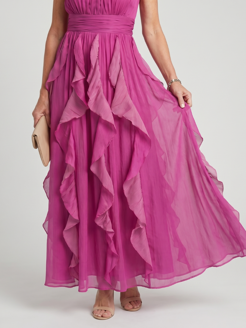 Pink halter maxi dress with a ruched bodice and cascading layered ruffle skirt