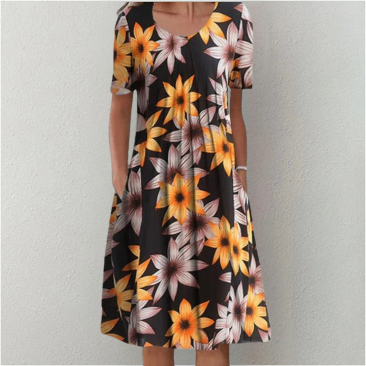 Woman wearing the floral midi dress with pockets, walking outdoors on a sunny day.