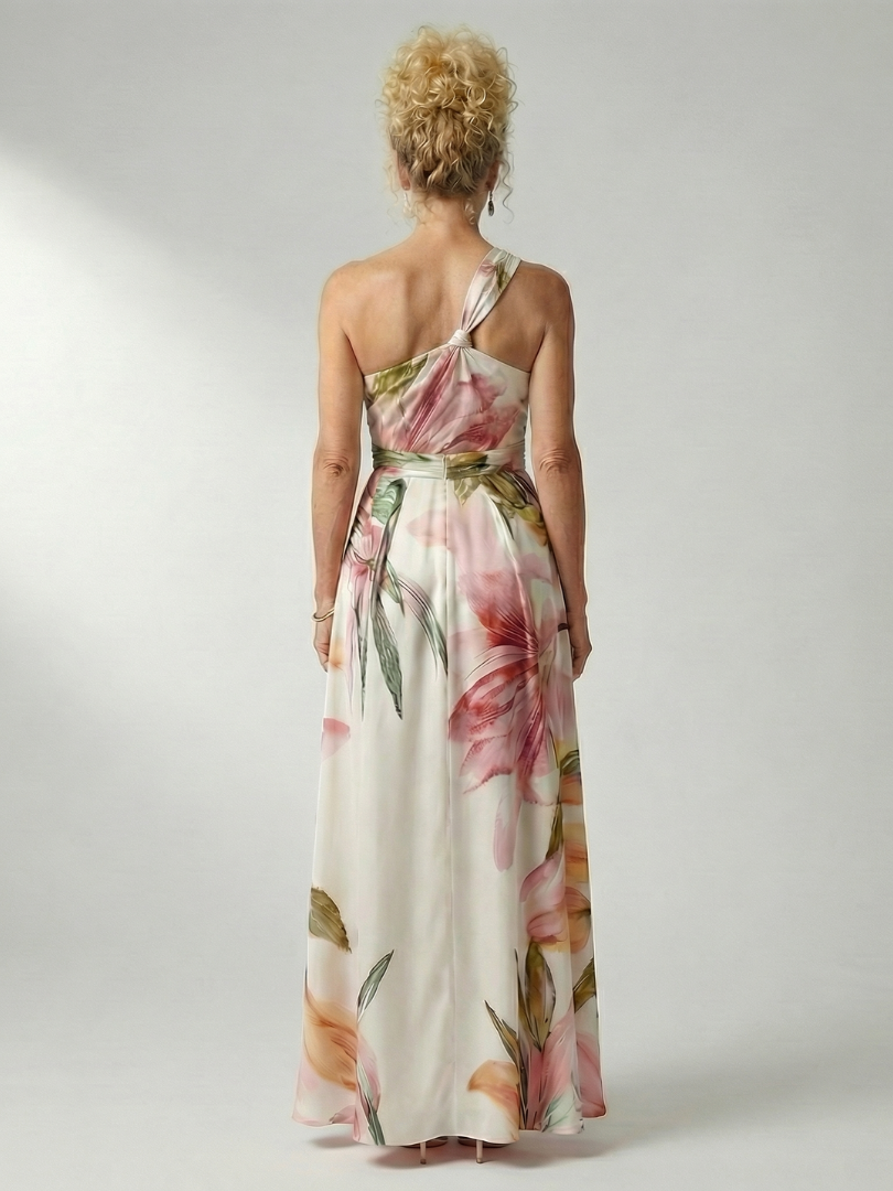 White floral halter-neck maxi dress with large bold print and flowing relaxed skirt