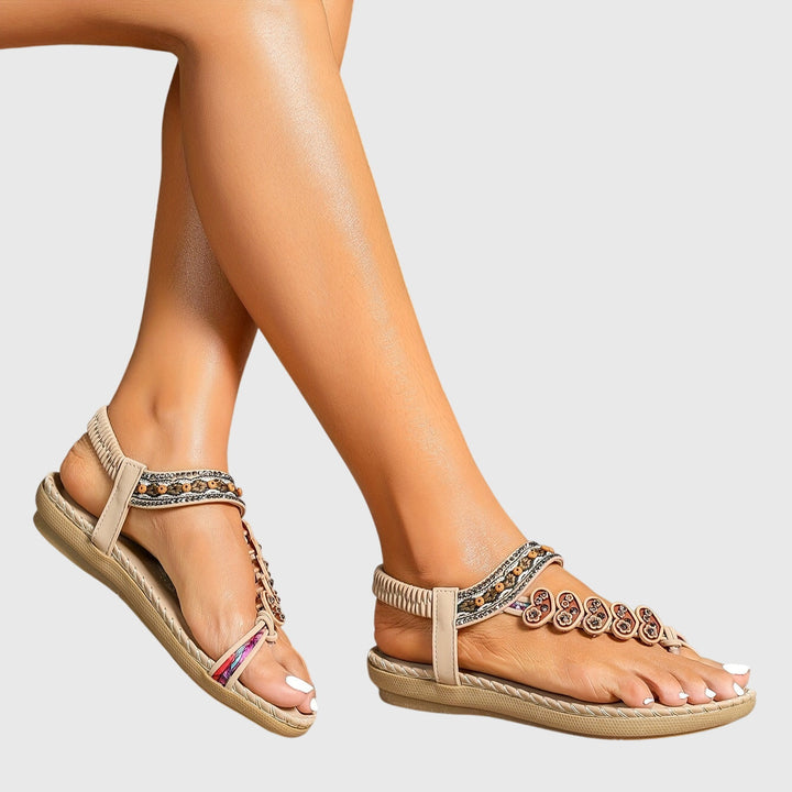 A woman standing comfortably in wide-fit cushioned support sandals with open-toe straps.