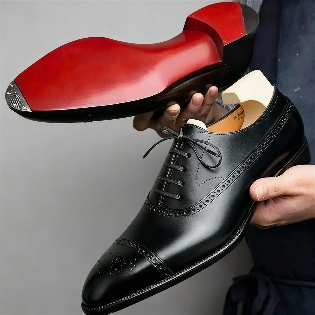 Men's black executive closed-toe shoes with a sharp polished silhouette and contrasting sole