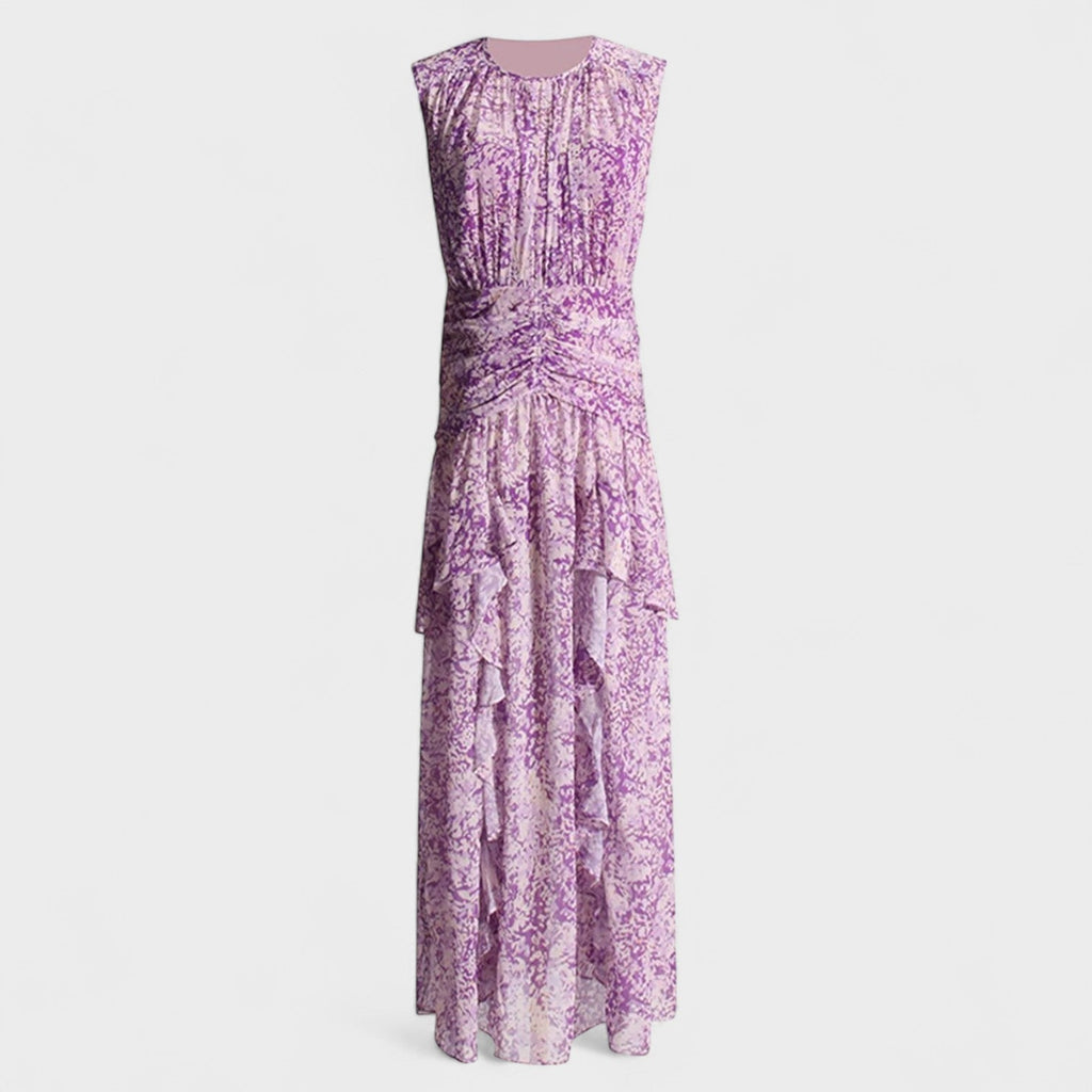 A purple floral fluid midi dress with a gently fitted bodice and flowing skirt