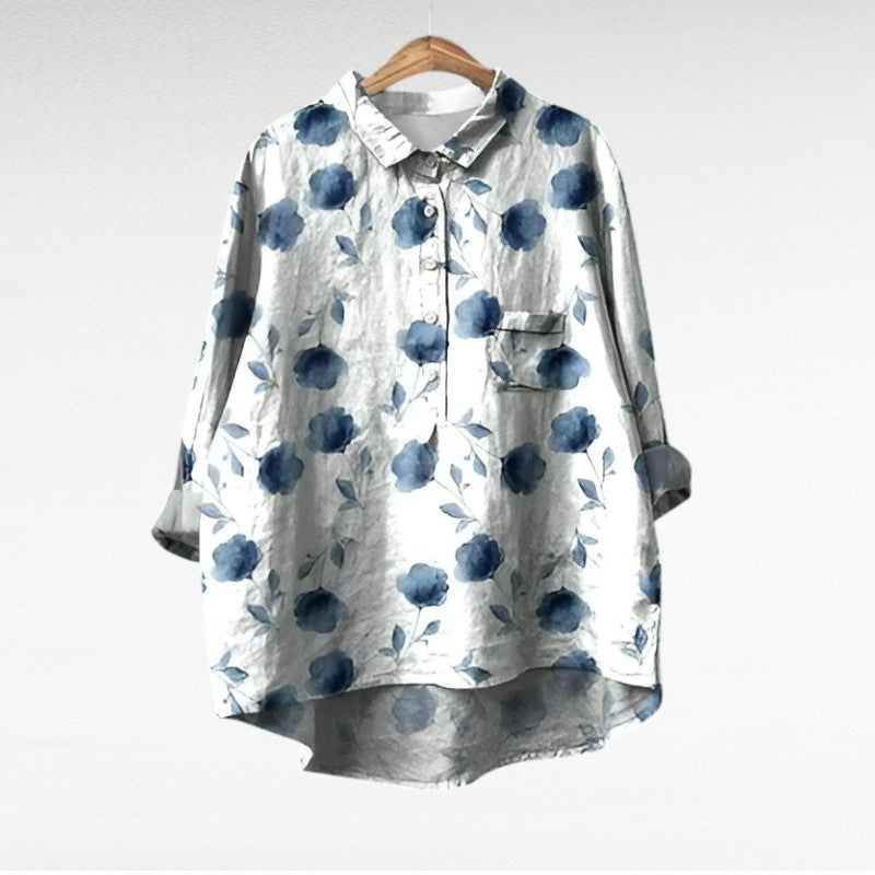 Woman wearing a printed summer blouse with a gentle, flattering drape.