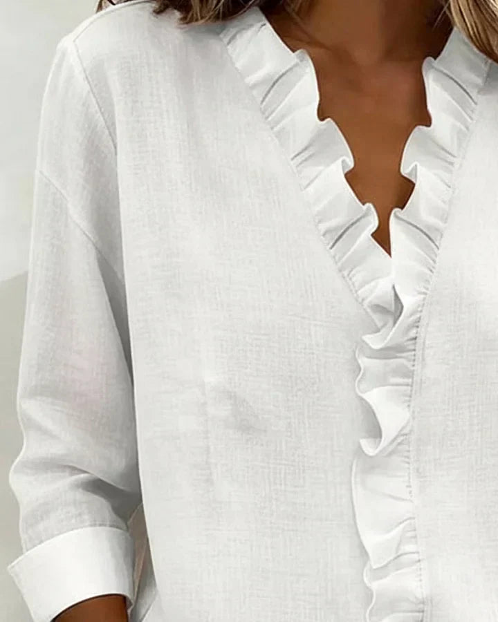Pink women's V-neck blouse with decorative frill collar and long sleeves
