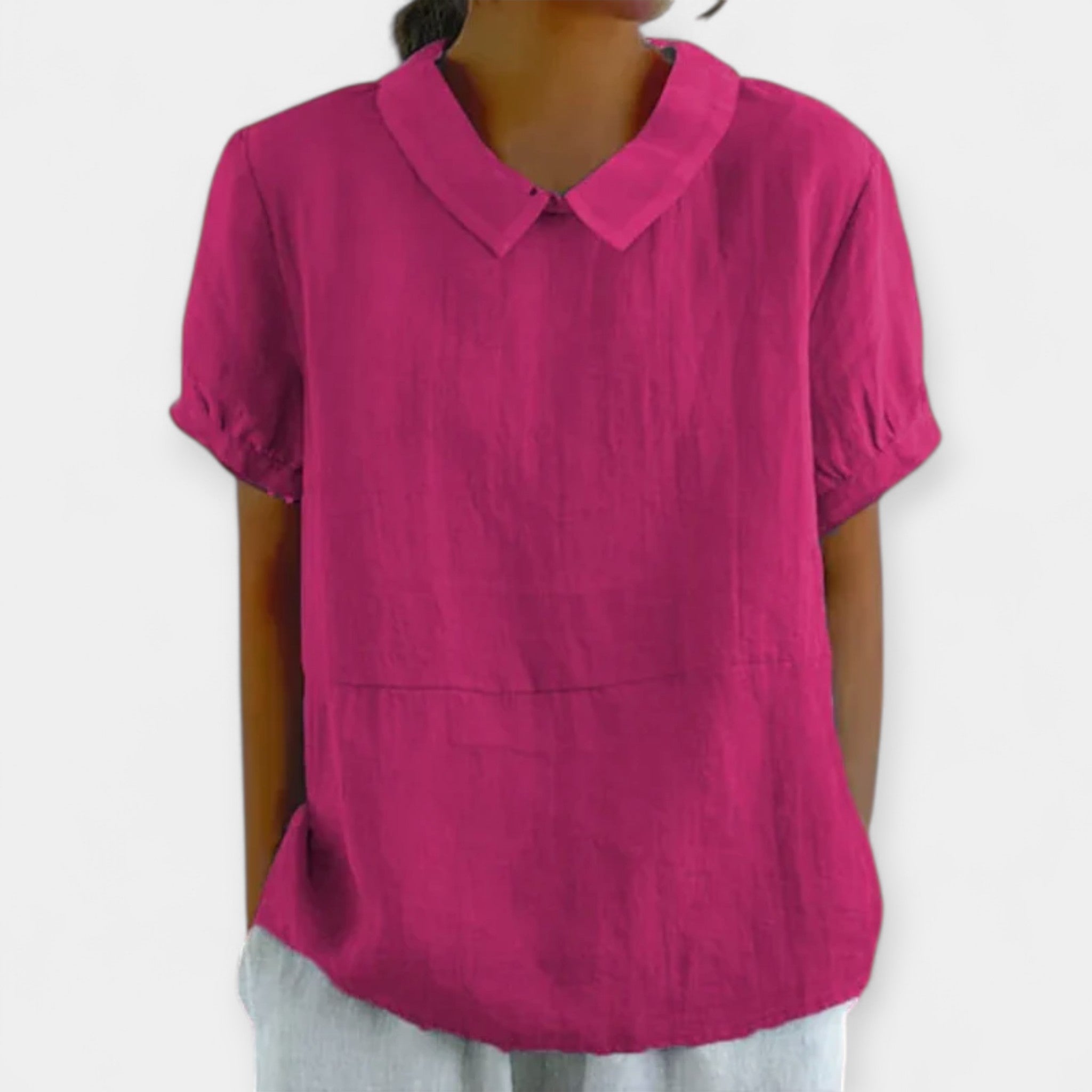 Women's fitted collar-neck top in pale blue with delicate embroidery and button detailing