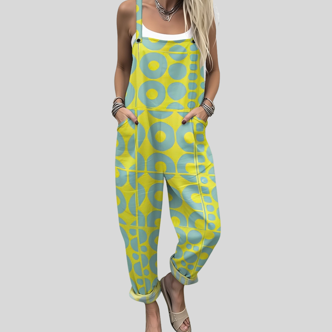 Wide-leg retro dungarees with cheerful yellow and teal geometric circle-and-dot print, adjustable straps, from Mary Cork Ireland.
