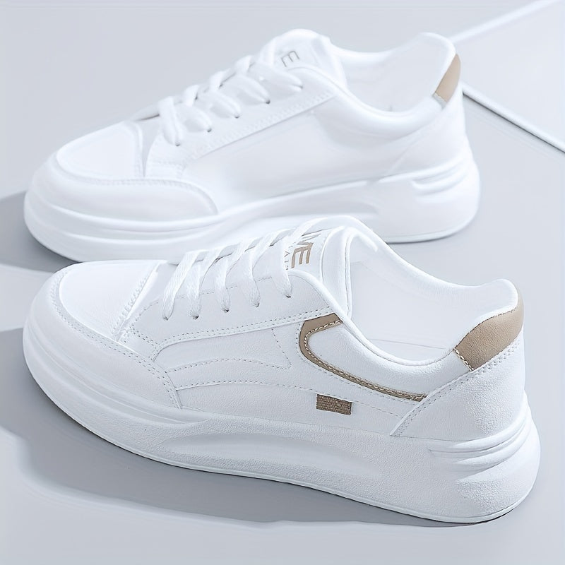A woman in crisp white light comfort trainers paired with jeans.