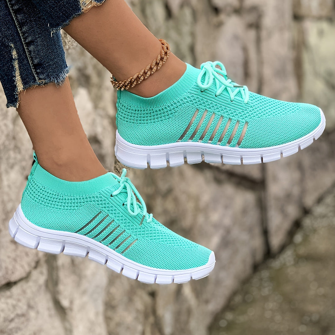 A woman wearing light breathable sock-style comfort shoes