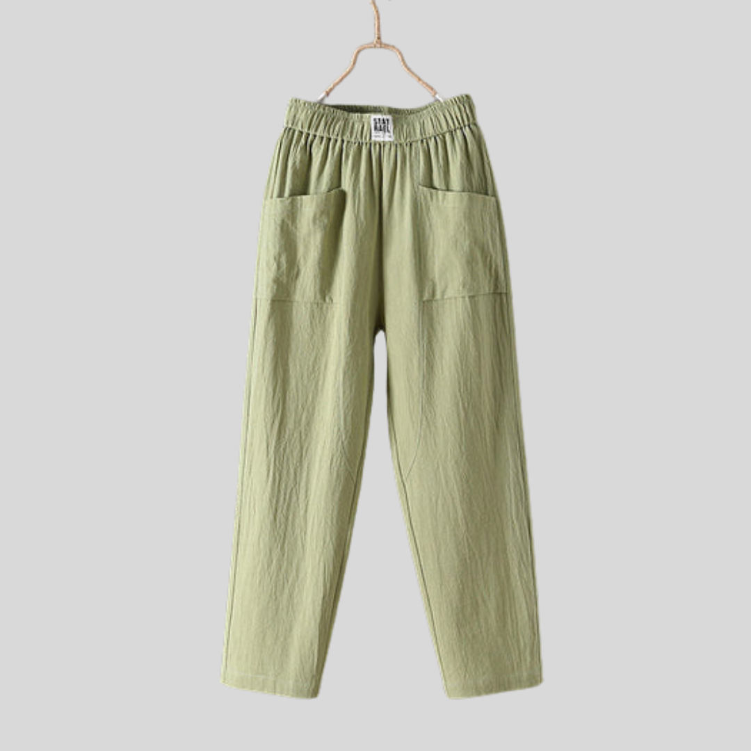 Relaxed tapered trousers with roomy front patch pockets and an elastic waist.