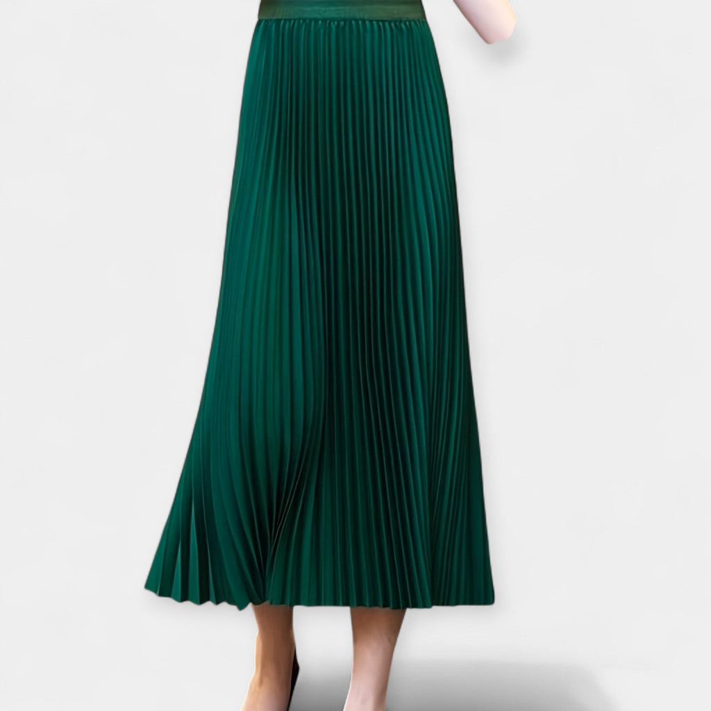 Wide pleated high-waist midi skirt in soft blush pink with a flowing silhouette