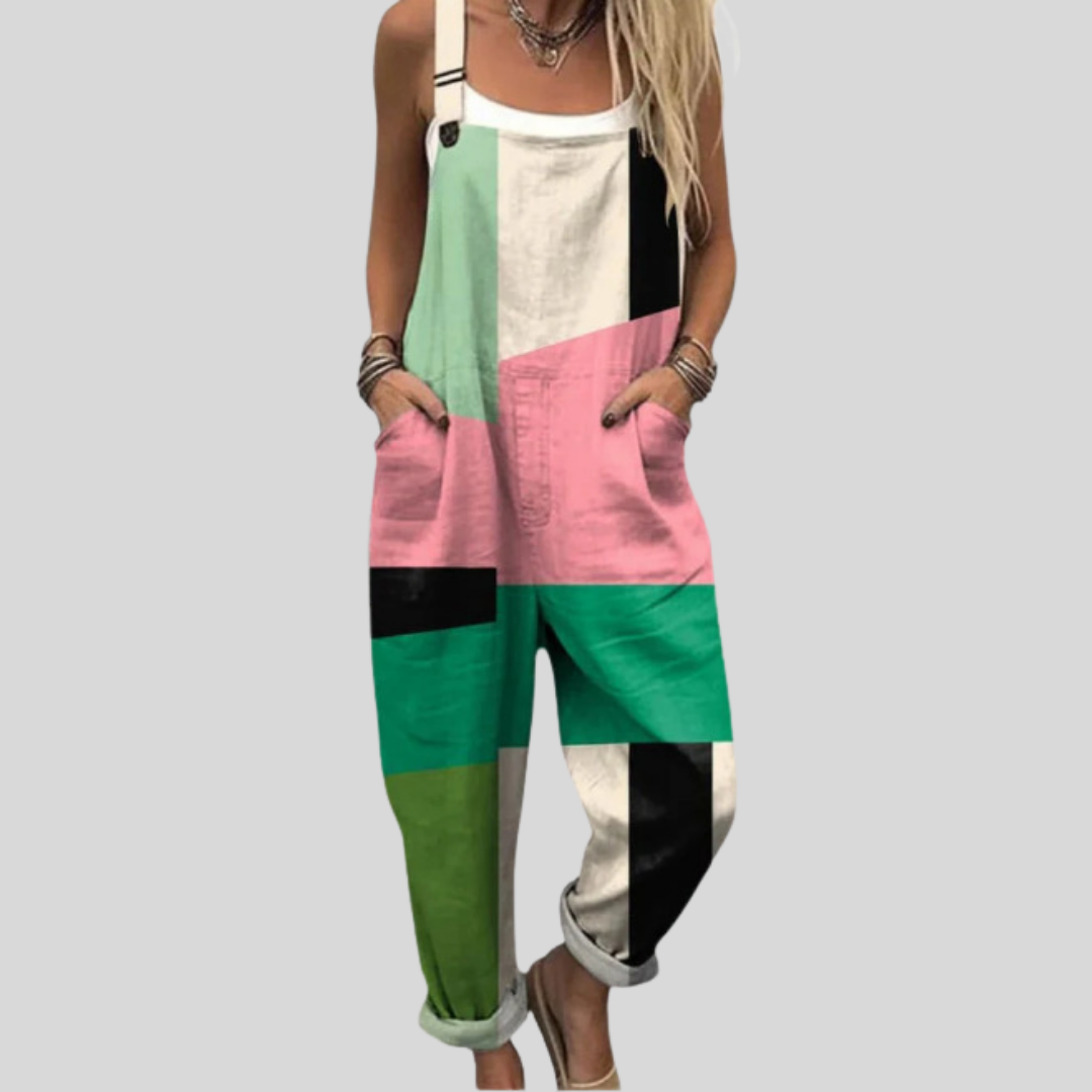 Women's wide-leg dungarees with a geometric colour-block patchwork print in mint green, soft pink, black and cream.