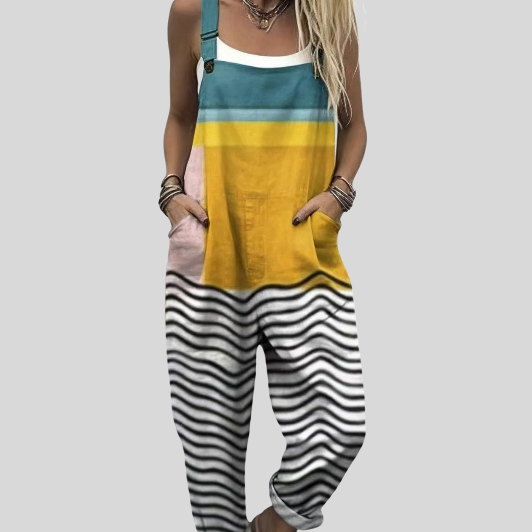 Women's wide-leg dungarees in teal and yellow colour-block with a black-and-white wave stripe pattern at the leg.