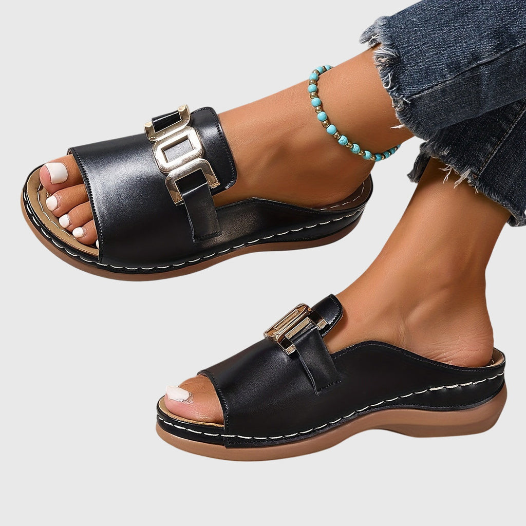 Minimalist flat sandals in beige and white with a clean, simple strap design