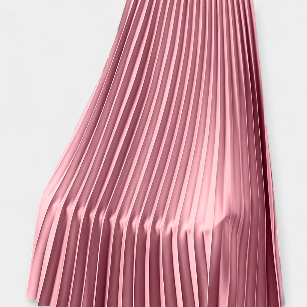 Wide pleated high-waist midi skirt in soft blush pink with a flowing silhouette